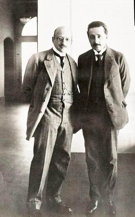 Fritz Haber and Albert Einstein standing together in a sunlit hall