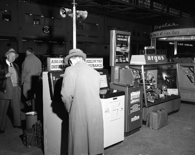 Historic photo of an airport flight-insurance vending machine