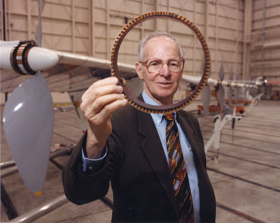 Paul MacCready holding a Speed Ring, a device he invented for competitive glider flying.